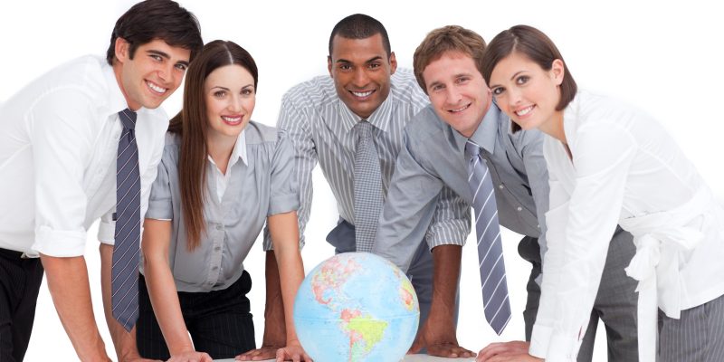 portrait-business-team-around-terrestrial-globe